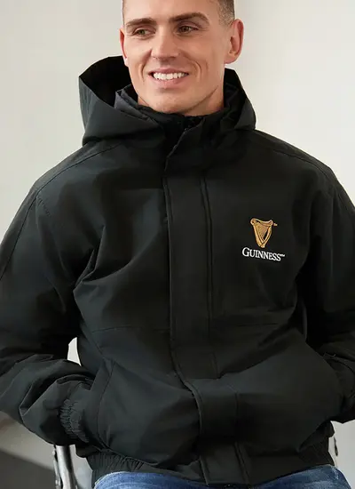 Man wearing an Guinness Jacket in Black Official Merchandise 